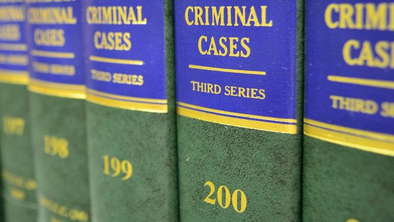 An image of books on a shelf titled &#039;Criminal cases&#039;