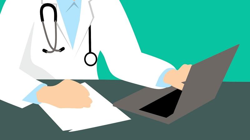 An illustration of a doctor adding typing information to a laptop