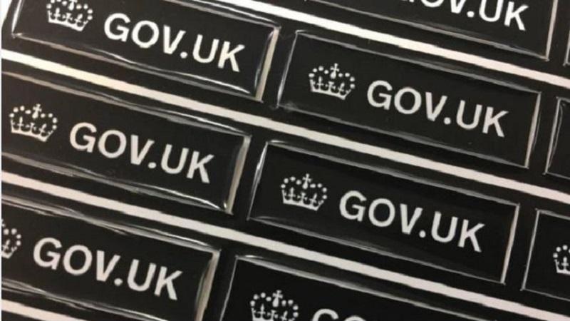 An image of small labels bearing the text and insignia of GOV.UK