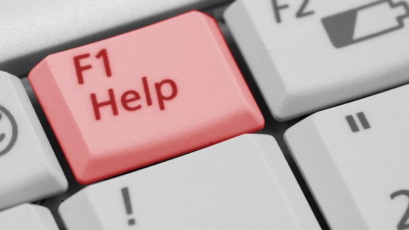An image of a red keyboard button reading &#039;Help&#039;