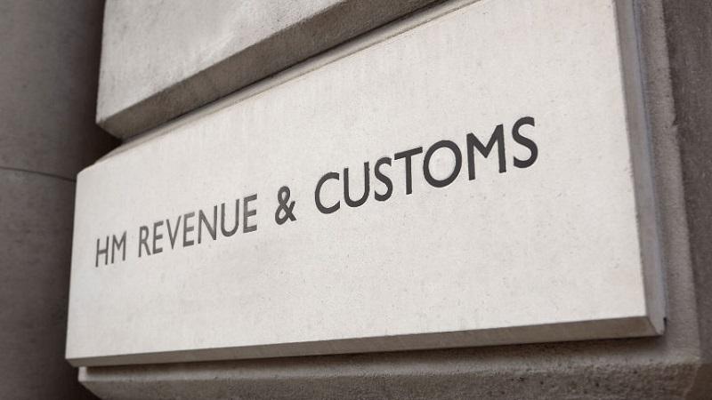A close-up image of the name &#039;HM Revenue and Customs&#039; embossed on a building facade