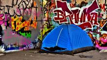 An image of a tent pitched in an urban environment