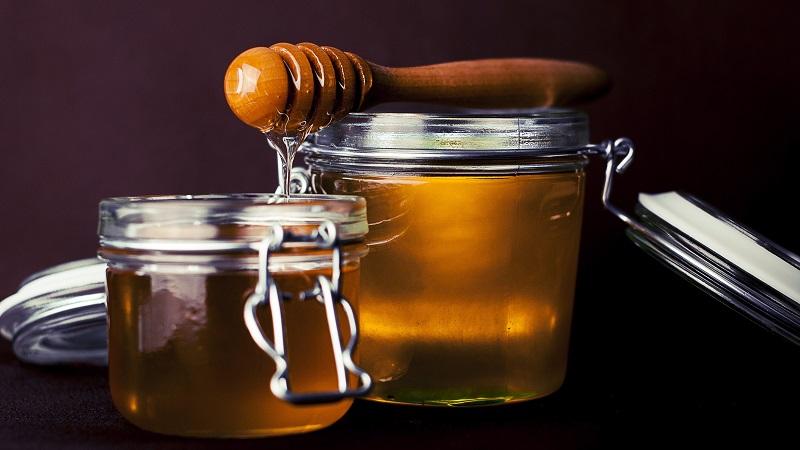 An image of pots of honey