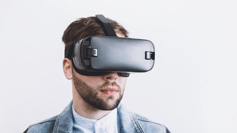 An image a man wearing a virtual-reality headset